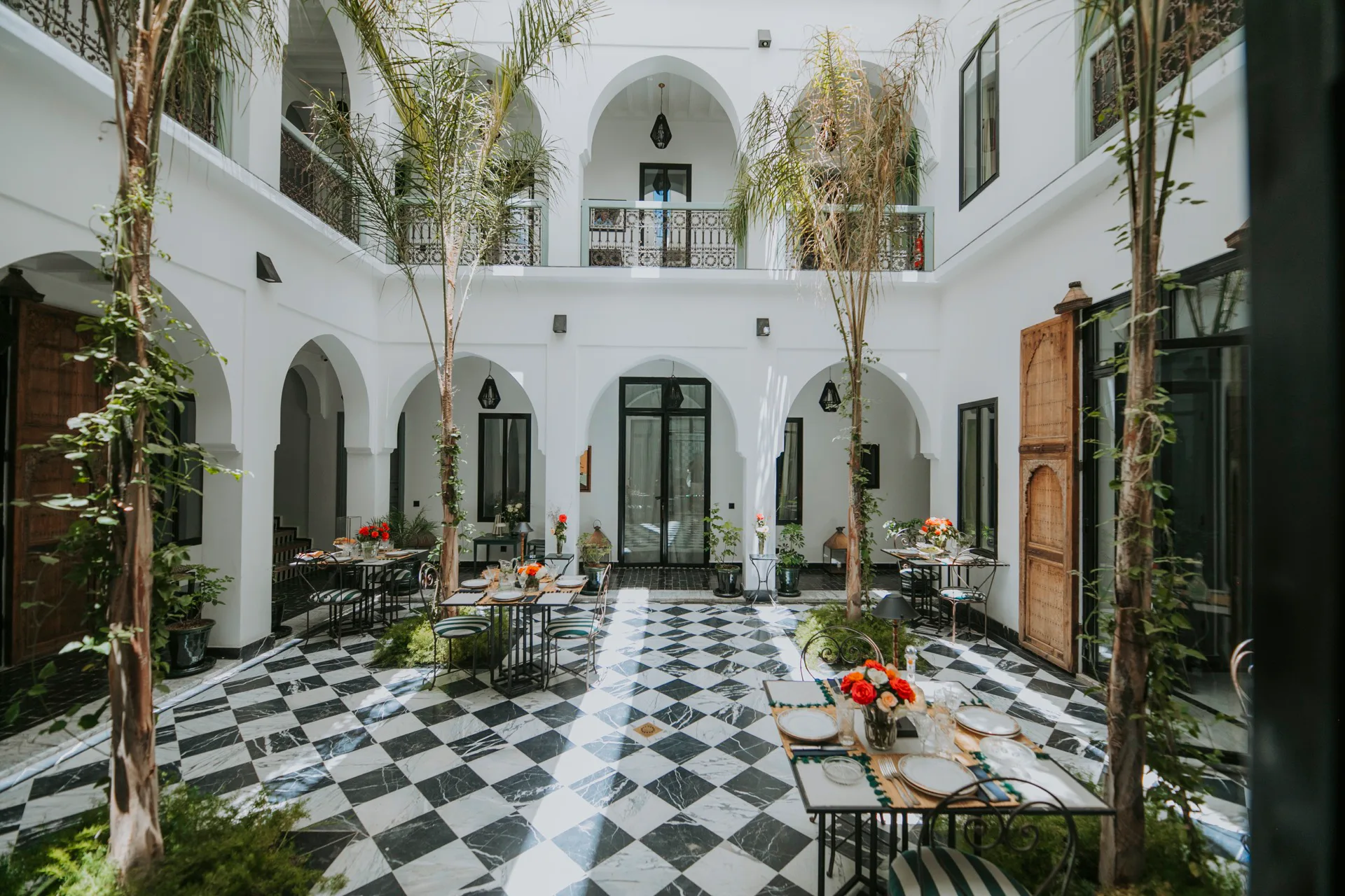 The grand tree-lined courtyard at Palazzo Montefiore